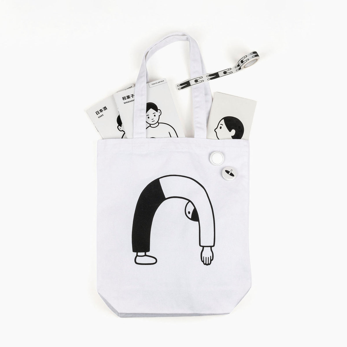 Noritake books and notebook in Tote Bag with badges