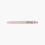 Hellrosa Uniball Zento Gelstift mit 0,38 mm Spitze, weichem Gummigriff und gefedertem Metallclip auf weißem Hintergrund.